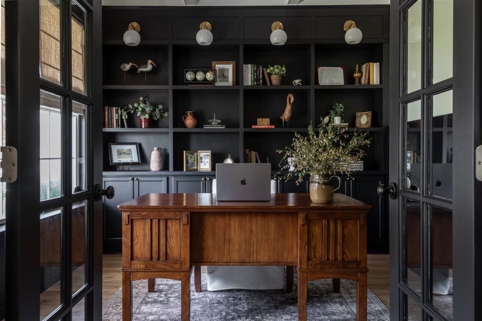 Stylish study space with vintage desk capturing the essence of dark academic style, by designer Julissa R of Decorilla