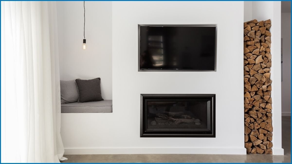 A contemporary media wall combining a mounted TV, built-in storage, and a fireplace.
