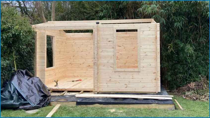 A common approach is to use pressure-treated softwood for the frame and a premium wood like Cedar for the exterior cladding.